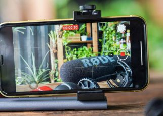 Person using Snapchat hands-free recording feature on smartphone indoors