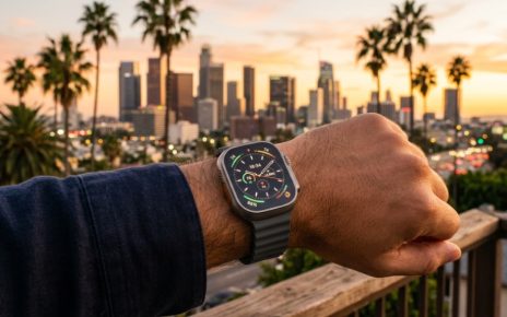 Person wearing a luxury smartwatch outdoors against a sunny California backdrop.